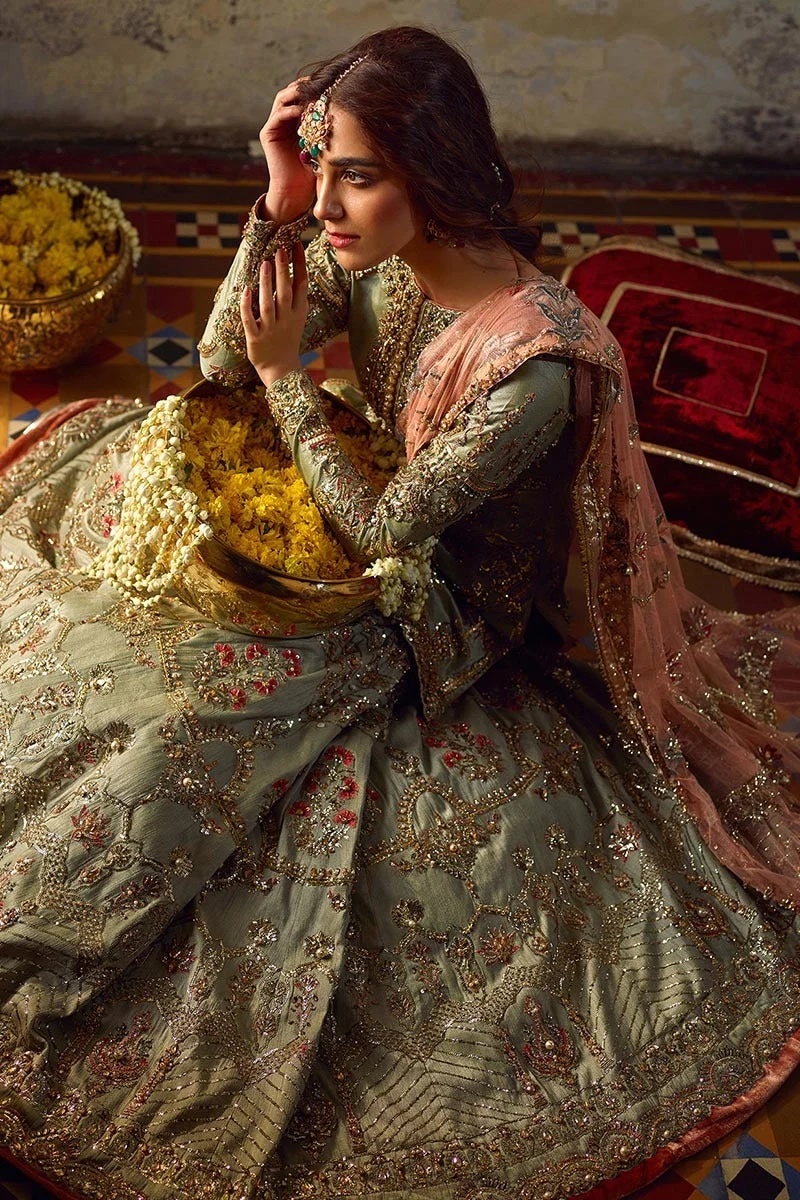 Gul- e- zamurd pakistani fashion outfit in gold, peach, red tones.